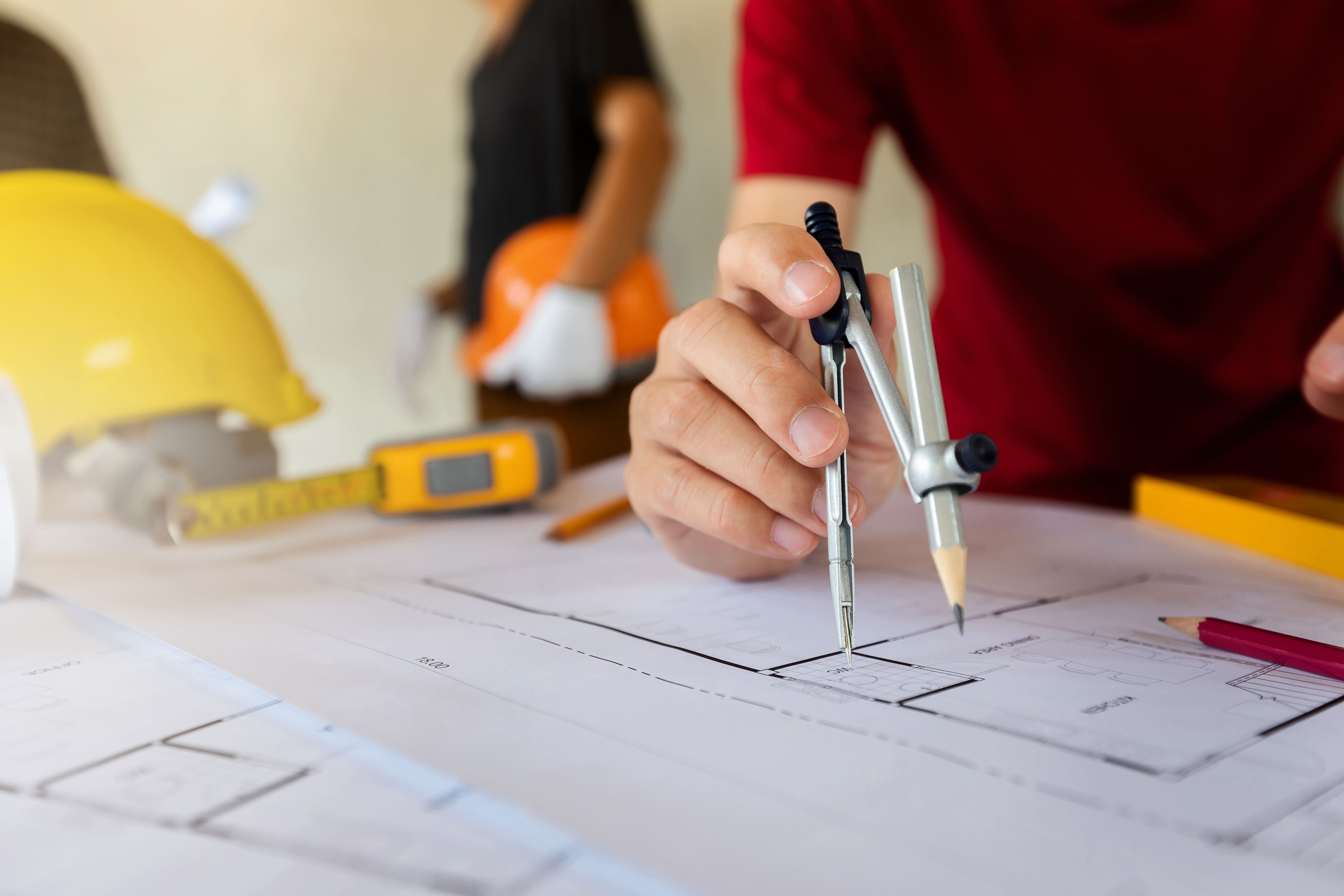 an-architect-or-engineer-uses-a-divider-gauge-on-t-2023-11-27-05-05-26-utc